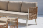 Outdoor rope woven sofa and travertine coffee table combination from 44230 collection