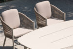 Modern woven outdoor chair with curved aluminum backrest